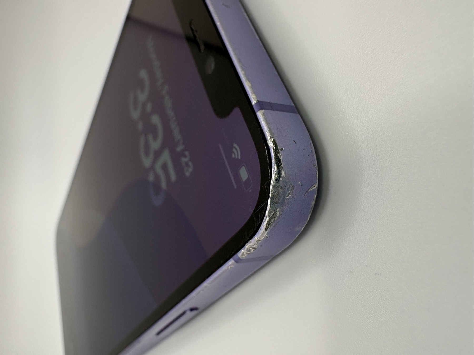Unacceptable device — front view showing cracks or heavy damage